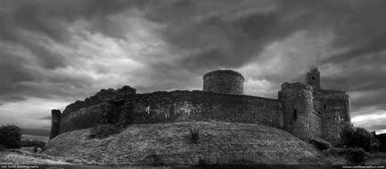 The Storm at Kidwelly Castle -- Intense black and white of a storm over Kidwelly Castle, Wales