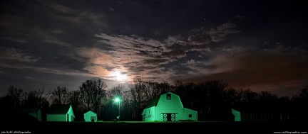 Sleeping Farm -- The full moon rises over a farmstead in western North Carolina, the lights making the barns appear green in the camera.  I could have color corrected, but I thought it looked rather neat.