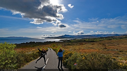 Coast of Ireland -- Two travelers enjoy the scene of the southwest coast of Ireland