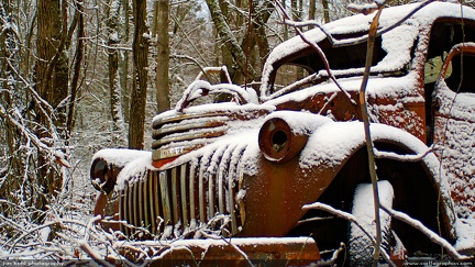 Snowy Truck -- This old truck sits in a snowy forest, probably not far from where it worked most of its life.