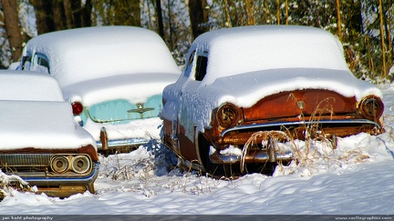 Snow Sedans -- Some very vintage cars with little caps of snow