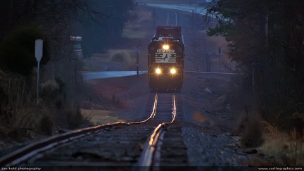 Rainy Railroad -- Norfolk Southern diesel runs a dark stretch of track in the rain near Goldsboro, NC