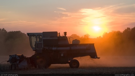 Late evening harvest -- This combine finishes up a field as dusk sets on an autumn evening
