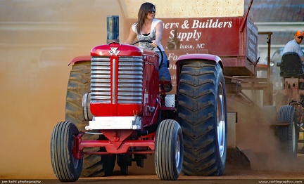 Taming the Beast -- Coty throttles up her mount at tractor pulls near Vale, NC.