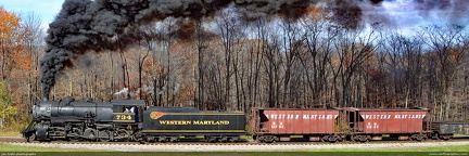 Steam train through the Mountains -- Western Maryland 2-8-0 #734 pulls a freight train up the long grade to Frostburg, Maryland on a brisk autumn day.