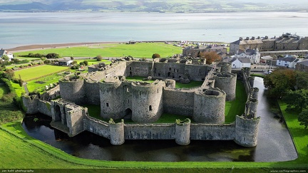 Beaumaris Castle on the Isle of Anglesey -- The impressive symmetry of Beaumaris Castle are even more impressive when you realize that this castle was never completed, and would have stood even taller.  
For details and history on Welsh castles, check out Jeff's Castles of Wales website (www.castlewales.com).