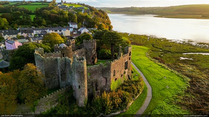 Sunrise at Laugharne Castle -- The early morning sun strikes the walls of Laugharne castle on the banks of the Taf estuary.  
For details and history on Welsh castles, check out Jeff's Castles of Wales website (www.castlewales.com).